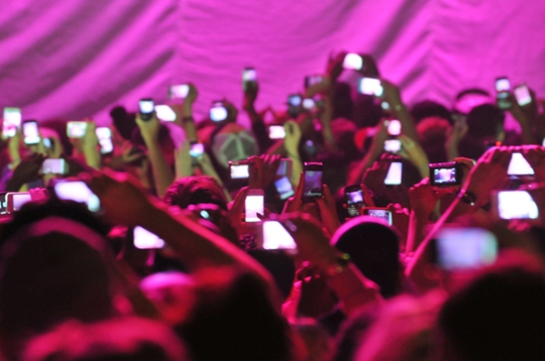 People holding cell phones at concerts