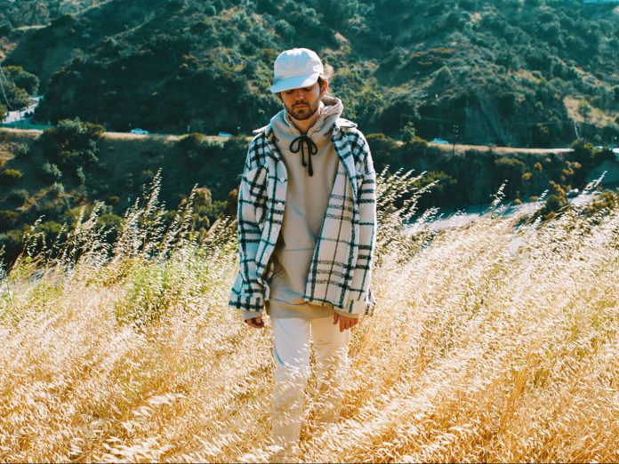 Madeon Madeon walking through field