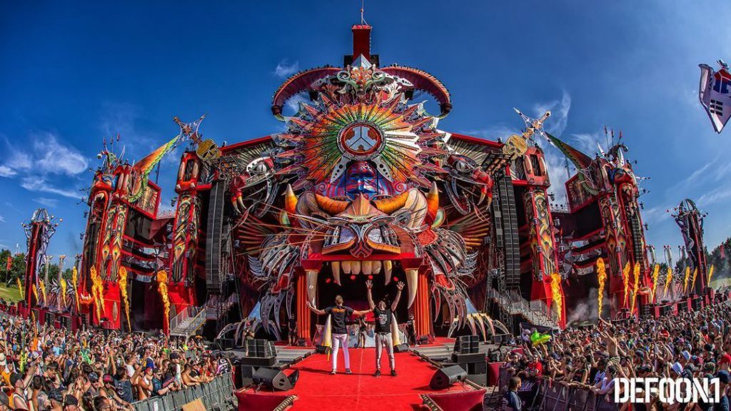 D-Block & S-Te-Fan posing in fromt of the mainstage at Defqon. 1 festival