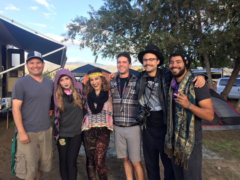 Six Dirtybird Campout attendees stand together smiling for the photo