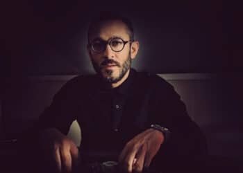 OMAIR sitting down black outfit