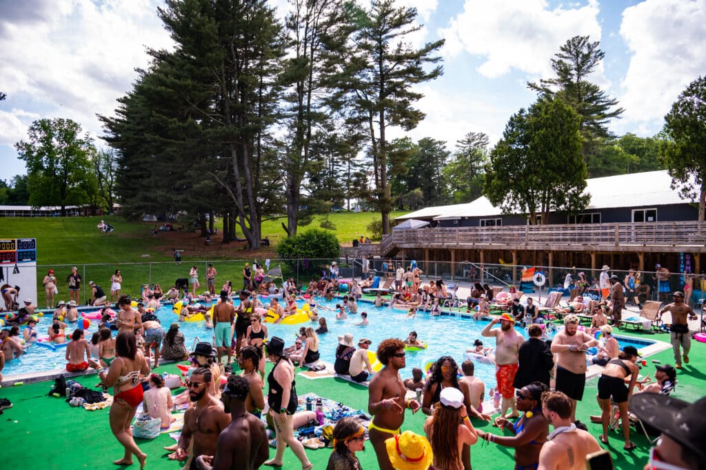 Campers convene at the pool for Showcation's Floatopia Pool Party