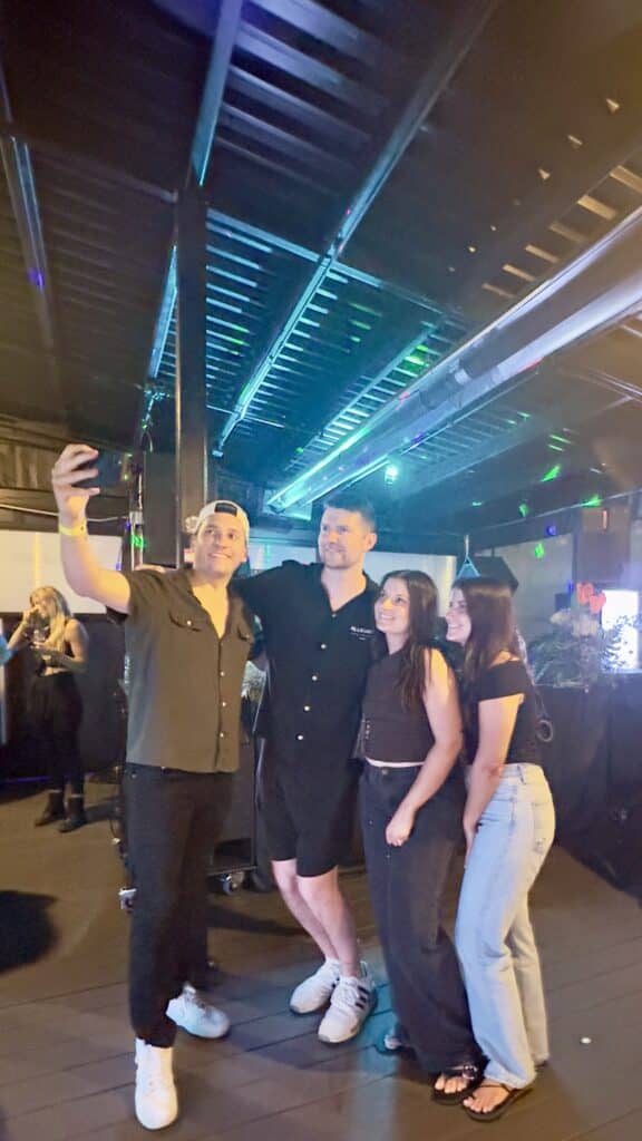 Simon Doty taking photos with fans at The Alley Deck in Detroit